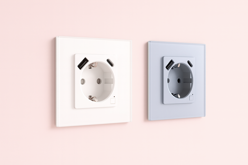 2 prise connecté usb sur un mur rose